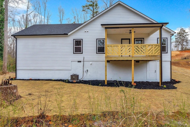 back of property featuring a yard and central AC unit