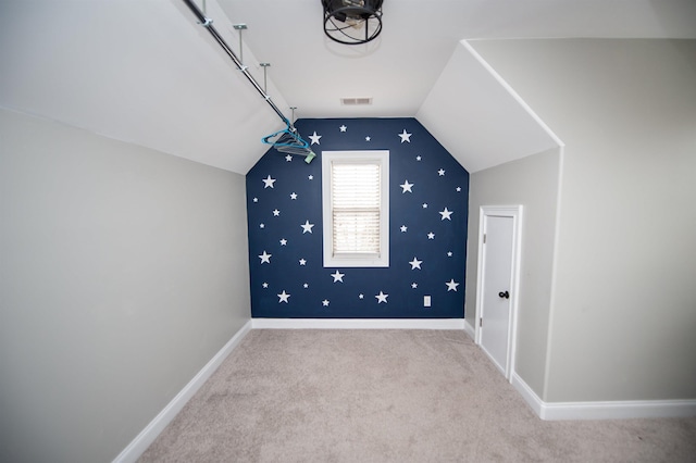 bonus room with baseboards, visible vents, carpet floors, and lofted ceiling