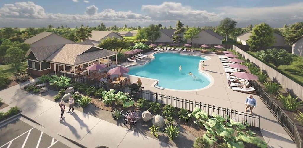 pool featuring a patio area, fence, and a residential view