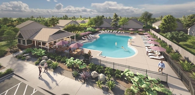 pool featuring a patio area, fence, and a residential view