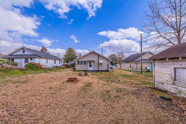 view of yard with an outdoor fire pit