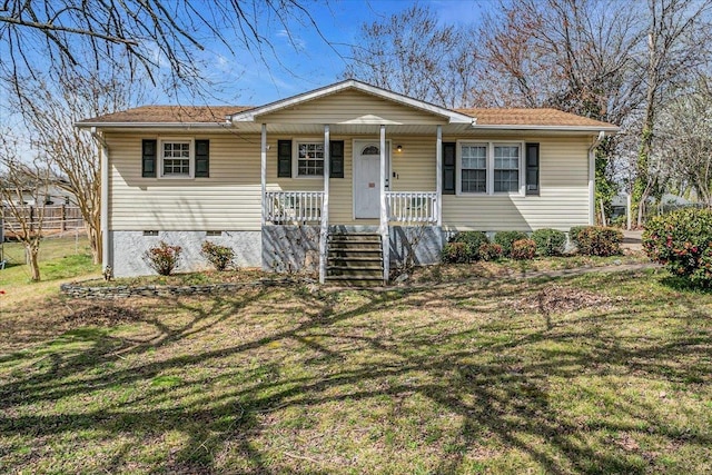 view of front of house featuring a front yard, covered porch, and crawl space