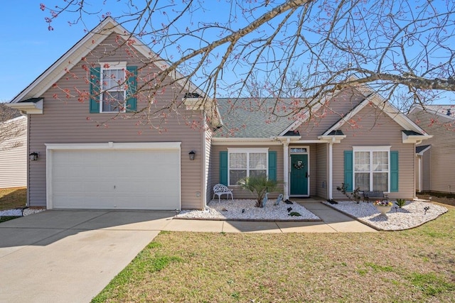 view of front facade featuring a garage, concrete driveway, and a front lawn