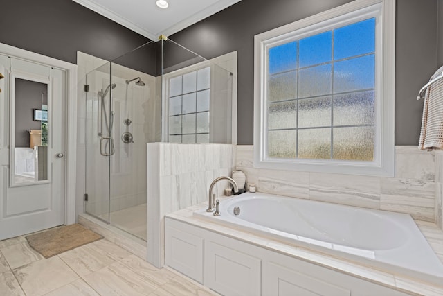 bathroom featuring a stall shower, crown molding, and a garden tub