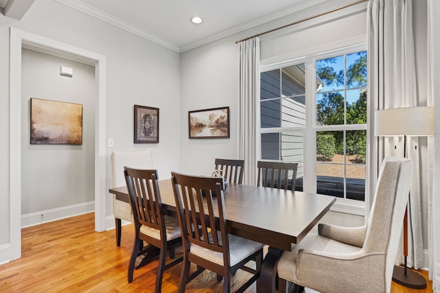 dining space featuring recessed lighting, baseboards, ornamental molding, and light wood finished floors