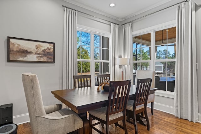 dining space featuring recessed lighting, baseboards, and wood finished floors