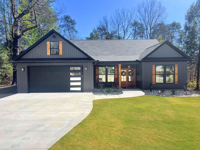 modern farmhouse style home with french doors, concrete driveway, a front lawn, and a shingled roof