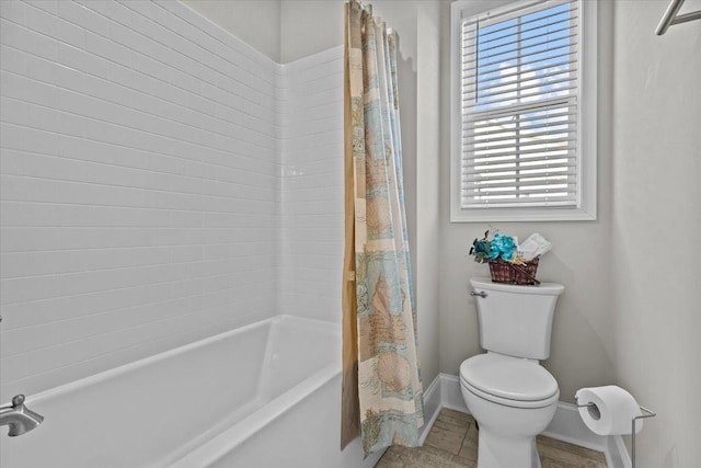 bathroom with tile patterned floors, shower / bath combination with curtain, toilet, and baseboards