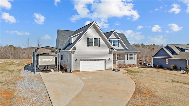 view of front of property with a detached carport, covered porch, and concrete driveway