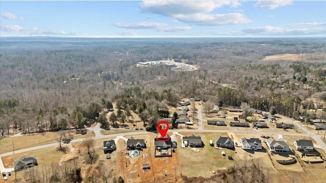 aerial view featuring a view of trees