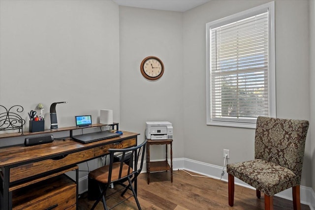 office featuring baseboards and wood finished floors