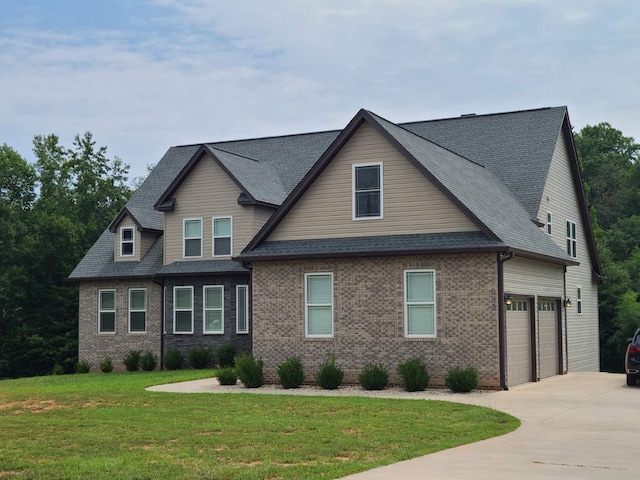 view of front facade featuring a front yard, driveway, a shingled roof, a garage, and brick siding