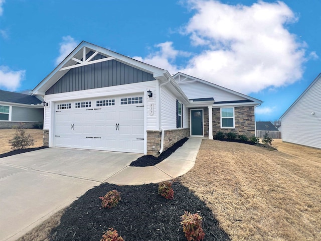 view of front of house with concrete driveway, an attached garage, board and batten siding, and stone siding