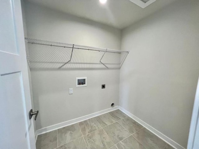 clothes washing area with laundry area, electric dryer hookup, baseboards, and washer hookup