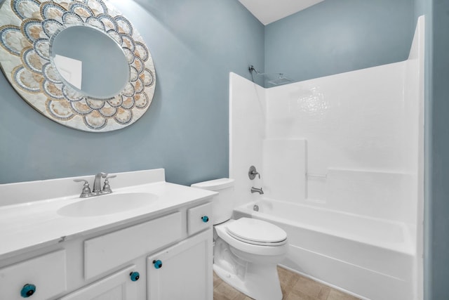 bathroom with toilet, vanity, and bathtub / shower combination