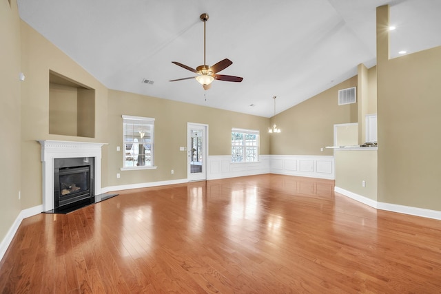 unfurnished living room with visible vents, ceiling fan, light wood-type flooring, and a fireplace with flush hearth