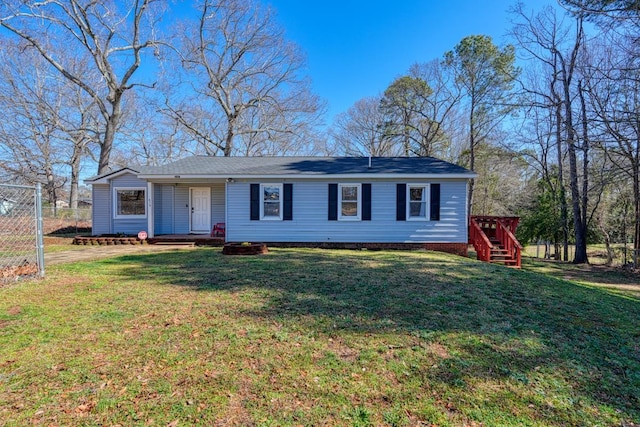 single story home featuring a front yard and fence