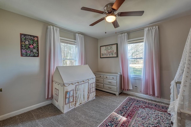 bedroom with baseboards, ceiling fan, and carpet flooring