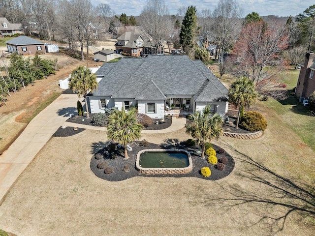 birds eye view of property with a residential view