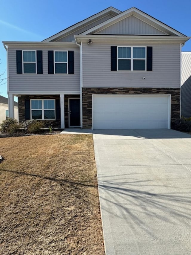 view of front of property with concrete driveway, a garage, and stone siding