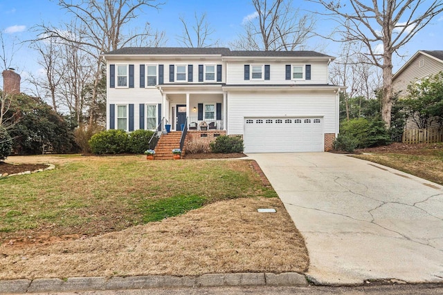 view of front facade with covered porch, driveway, an attached garage, and a front yard