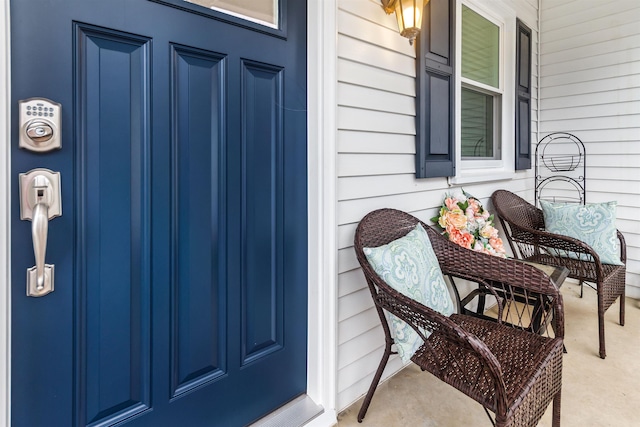 view of exterior entry with a porch