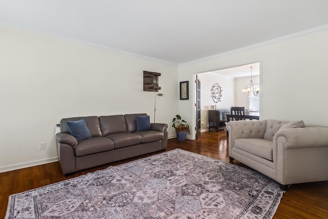 living room featuring baseboards, wood finished floors, and ornamental molding