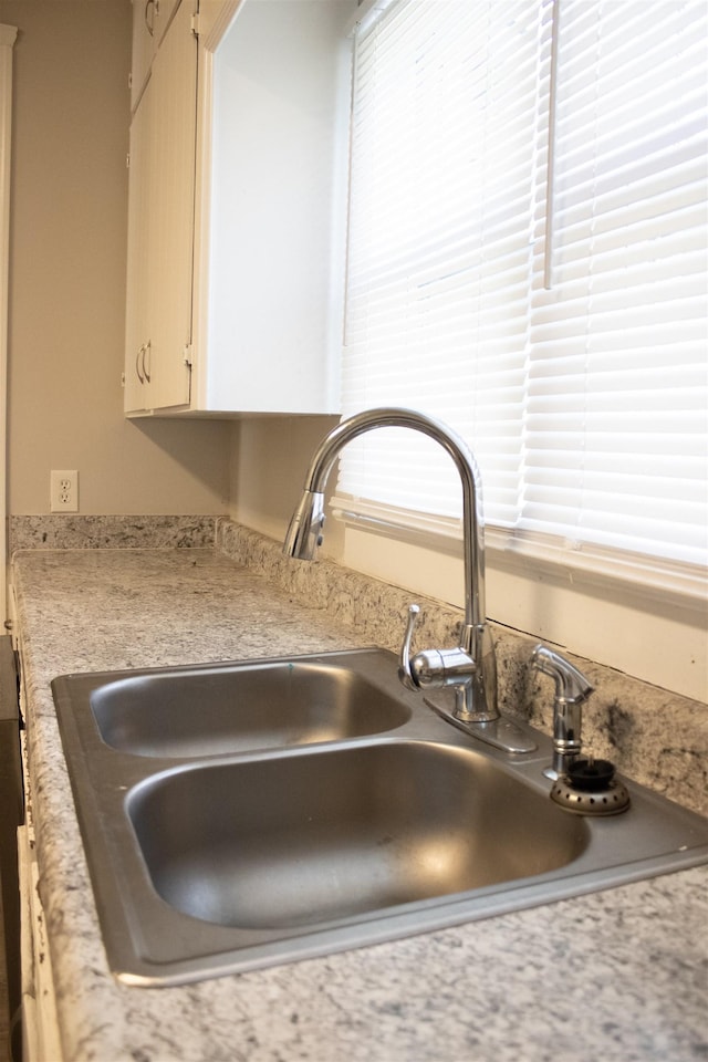 room details featuring a sink and light countertops