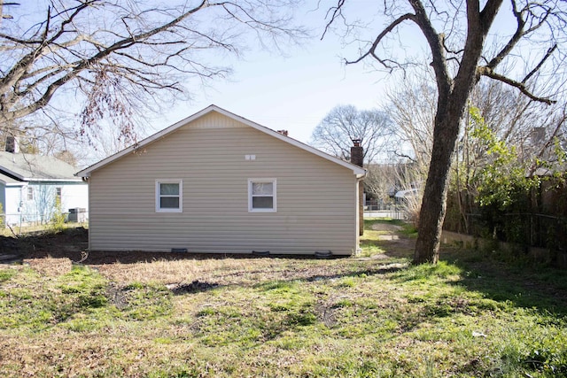 view of property exterior with a chimney