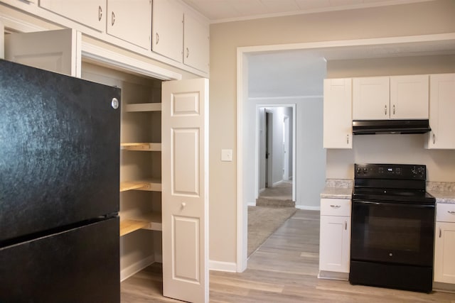 kitchen with black appliances, under cabinet range hood, light countertops, light wood-style flooring, and white cabinetry