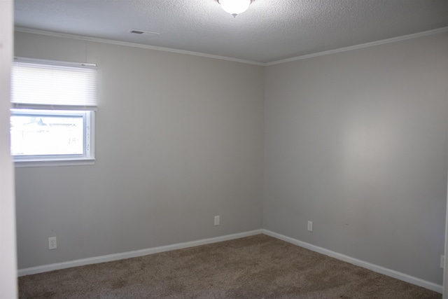 unfurnished room featuring baseboards, carpet, ornamental molding, and a textured ceiling