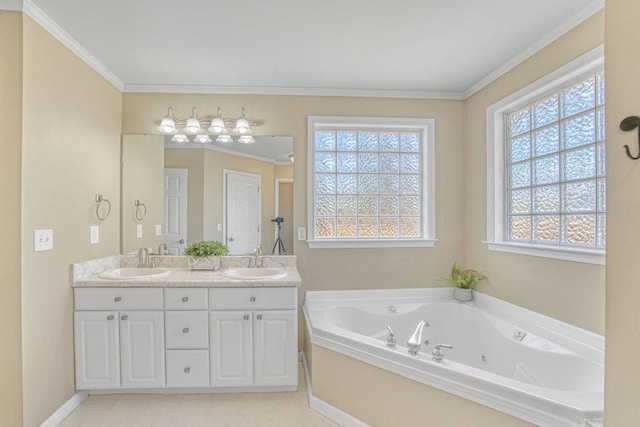 bathroom featuring double vanity, a tub with jets, crown molding, and a sink