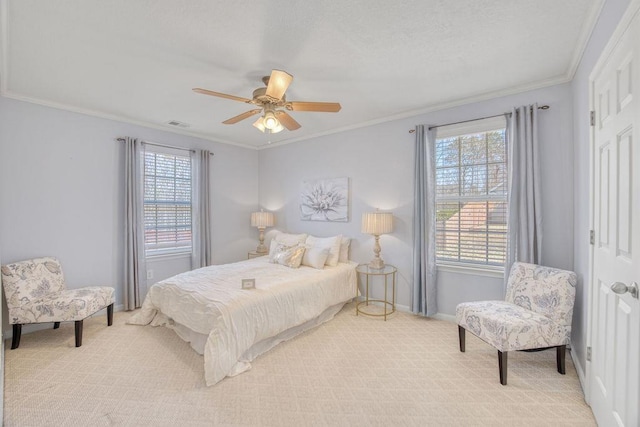 bedroom with crown molding, a ceiling fan, baseboards, and light carpet