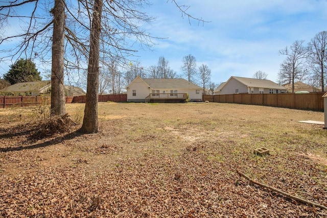 view of yard with a fenced backyard