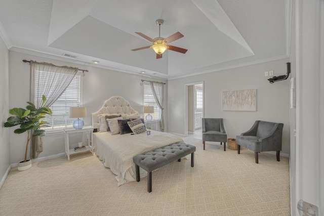 bedroom featuring visible vents, a raised ceiling, baseboards, and crown molding