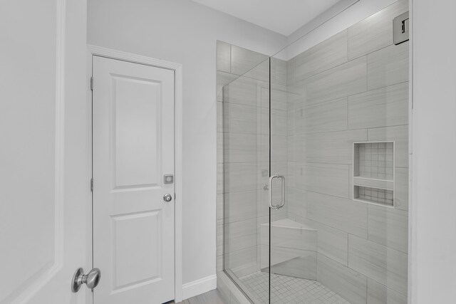 full bathroom with a shower stall