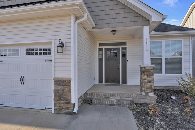 property entrance featuring stone siding and roof with shingles