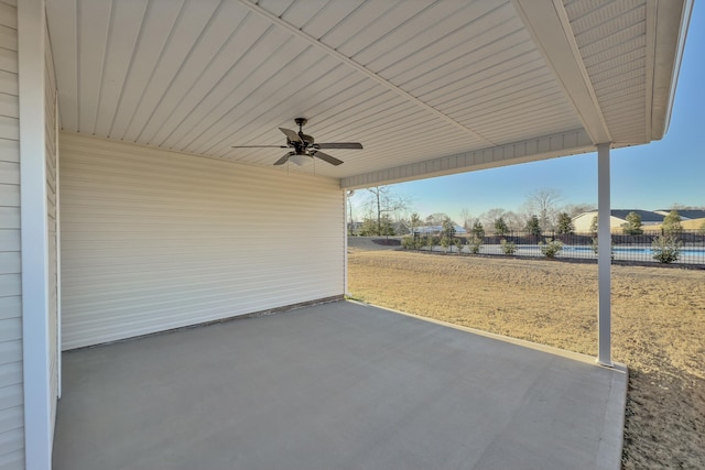 view of patio / terrace featuring ceiling fan and fence