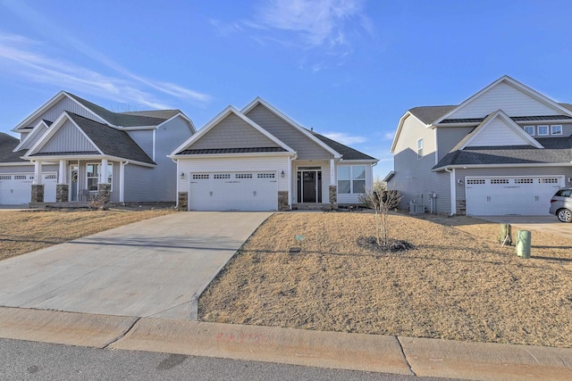 craftsman-style home with driveway, a standing seam roof, central AC, a garage, and stone siding