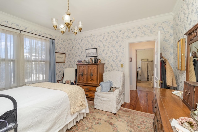 bedroom featuring wallpapered walls, crown molding, wood finished floors, and a chandelier