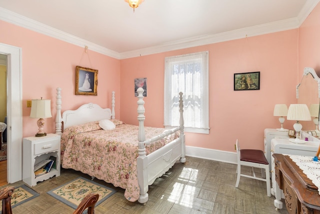 bedroom with baseboards and ornamental molding