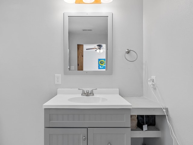 bathroom with visible vents, vanity, and ceiling fan