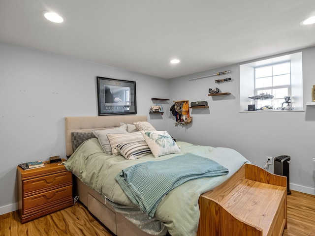 bedroom featuring recessed lighting, baseboards, and light wood finished floors