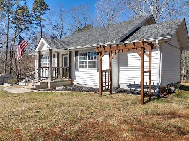 exterior space with crawl space, a lawn, a shingled roof, and a pergola