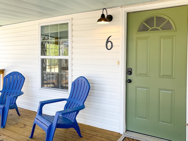 view of exterior entry with covered porch