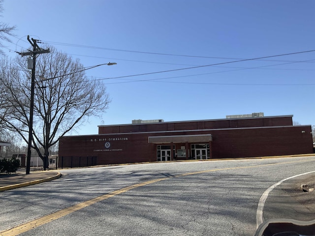 view of property with uncovered parking