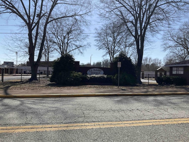 view of road with curbs and sidewalks