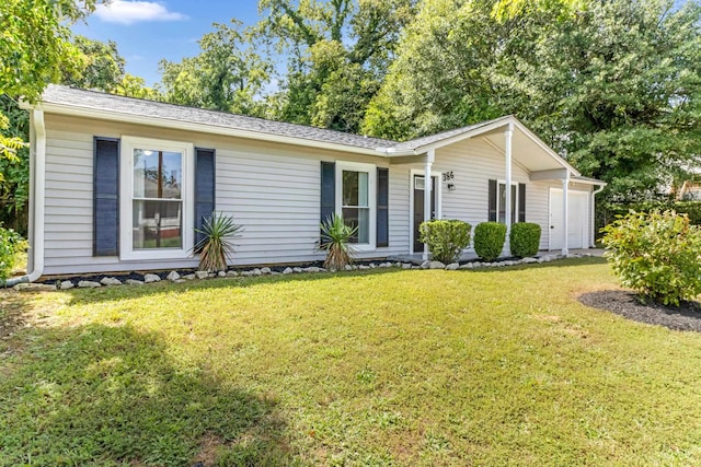 ranch-style home with an attached garage and a front lawn