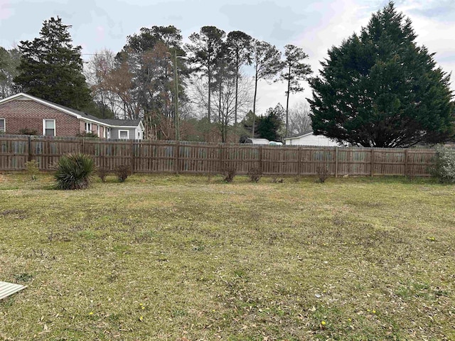 view of yard with fence