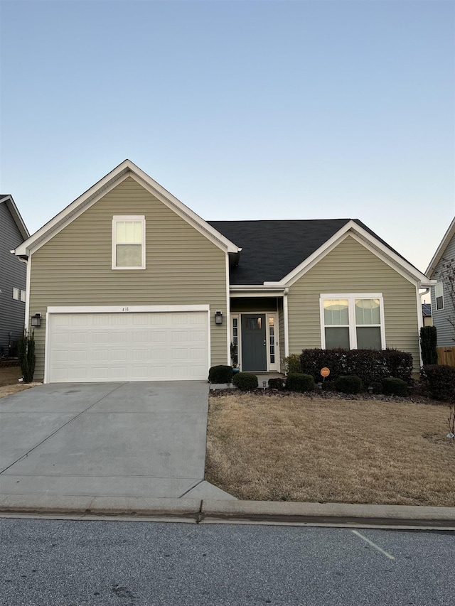 ranch-style house with a garage and concrete driveway